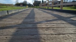 Millboard Vintage Decking used as pathway next to childrens playground
