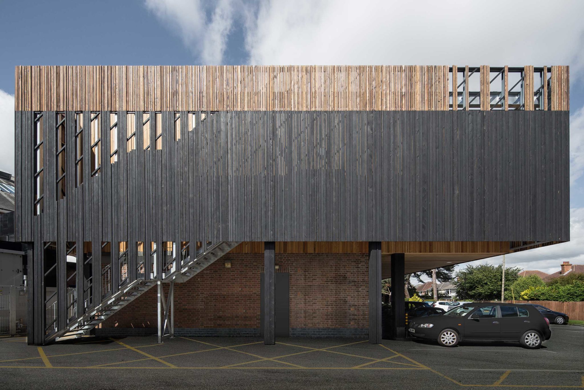 Charred and plain Siberian Larch timber cladding used on a leisure centre