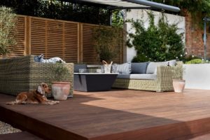 kebony decking terrace with garden furniture and a dog - Ecodek®