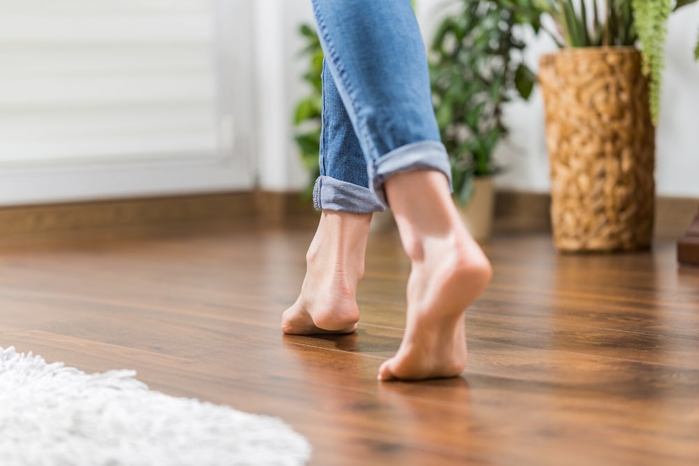 lady walking on heated wooden flooring